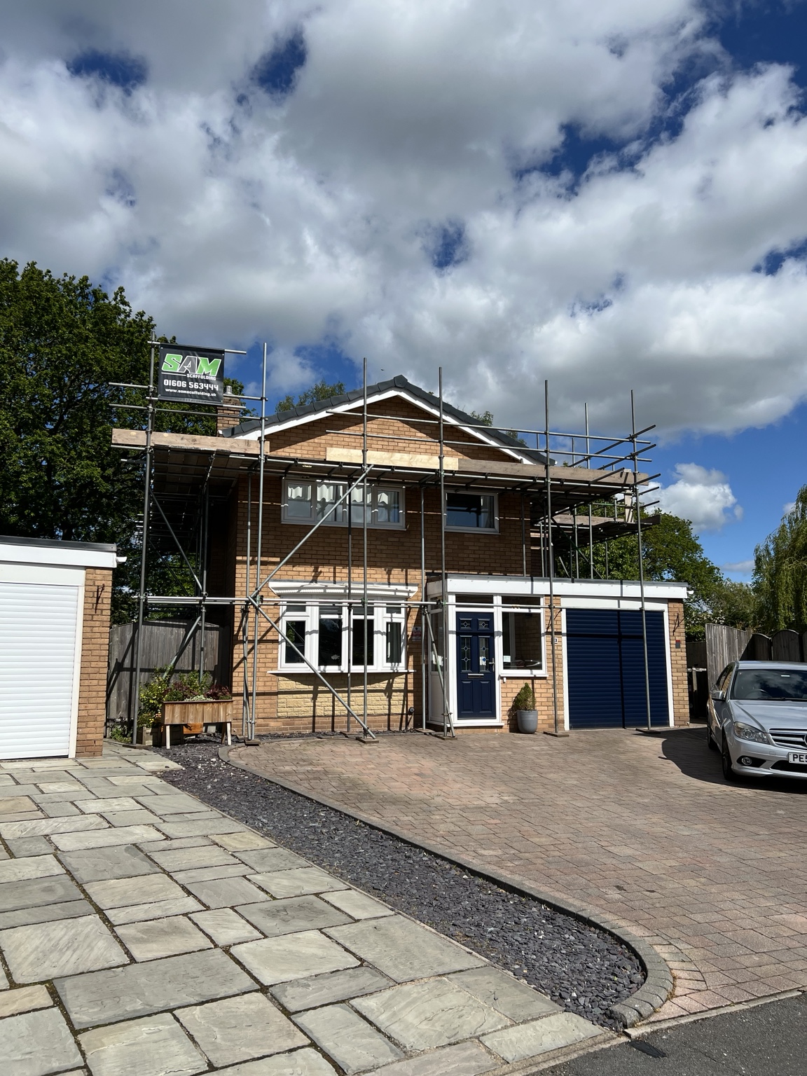 Scaffolding around a house for re-roofing in Barnton